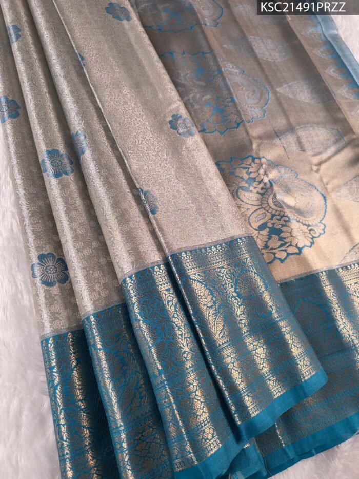 KSC21491_MAIN #PRZZ Silver and Teal Tissue Saree with Floral Motifs and Rich Zari Border - Image 1