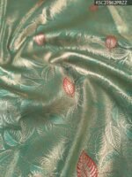 Elegant Green Tissue Saree with Intricate Zari Pallu and Rich Border - Image 2