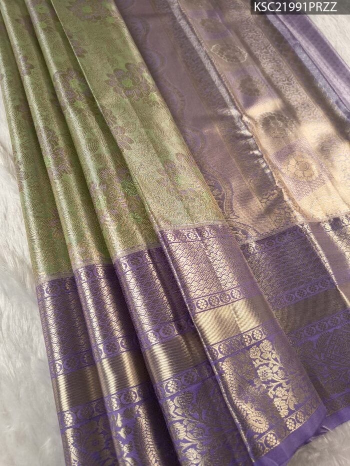 Green and Lavender Tissue Saree with Floral Motifs and Rich Zari Border - Image 1