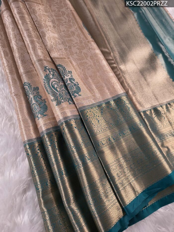 Beige and Teal Tissue Saree with Intricate Peacock Motifs and Rich Zari Border - Image 1