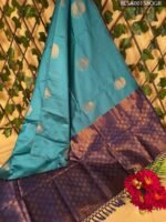 Beautiful Teal Semi Soft Silk Saree with Rich Purple Border and Golden Motifs